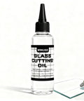 Pro Grade Glass Cutting Oil For All Cutting Tools Let Your Cutter Wheel Glide With Minimal Friction For Clean Scoring And Fewer Breaks Ideal For Stained Glass Mirrors Bottles Tiles Mosaic And Glass Cutter Wheels bottle next to a glass sheet and cutter tool
