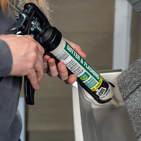 Applying Gutter And Flashing Exterior Sealant Advanced Hybrid Polymer Waterproof Sealant Medium Gray 10.1 Oz on gutter