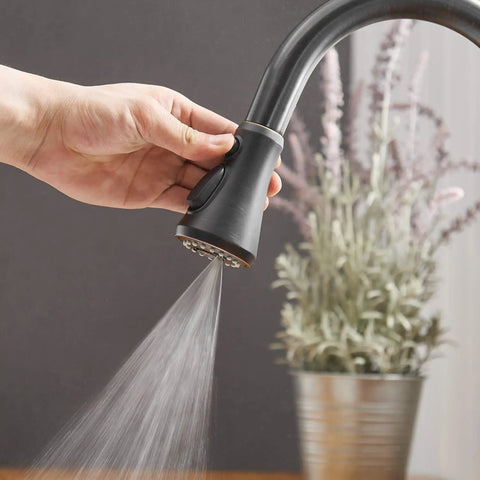 Close-up of Oil Rubbed Bronze Kitchen Faucet With Pull Out Sprayer, Three Spray Modes, Single Handle, High Arc Design in use