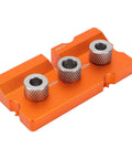 Rock Solid Double Hole Drilling Positioner With 12mm Eccentric Nut Drill Guide For Pro Grade Woodworking, showing orange aluminum base with three metal guide holes.