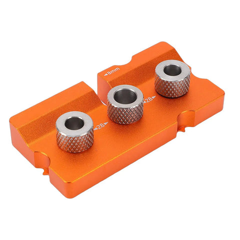 Rock Solid Double Hole Drilling Positioner With 12mm Eccentric Nut Drill Guide For Pro Grade Woodworking, showing orange aluminum base with three metal guide holes.