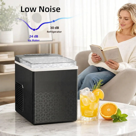 Compact Countertop Ice Maker With One Touch Auto Clean System That Skips The Grunt Work Cools Down Fast And Spits Out Crisp Crystal Clear Ice next to a drink on a table.