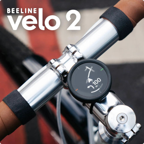 Velo 2 Bike GPS Computer With Wireless Global Navigation for Cycling mounted on handlebars showing route direction.