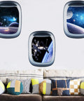 3D Planet Universe Galaxy Space Wall Decals Set With Spacecraft And Astronauts Peel And Stick Removable PVC Wall Murals on a living room wall