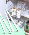 Smooth Glide Self Adhesive Drawer Slides And Pull Out Cabinet Tracks With Heavy Duty Sticky Tape Quick Fix Home Upgrade Effortless Storage Organization in kitchen storage with four white glide strips.