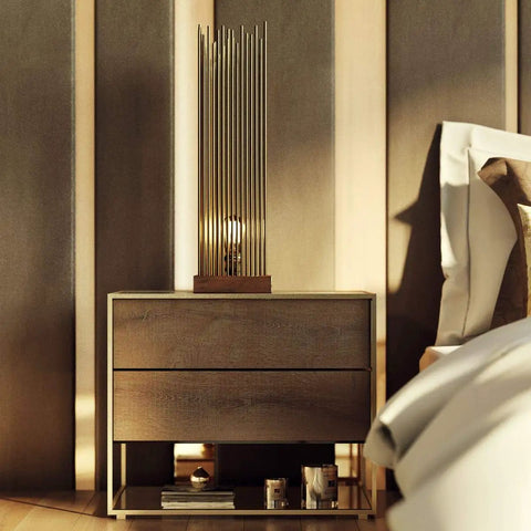 Modern bedroom with wooden nightstand and decorative lamp beside a neatly made bed.