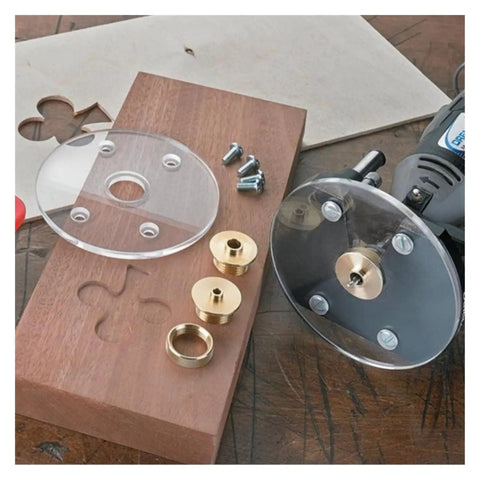 Solid As A Rock Metric Brass Router Guide Bushing Set on wood includes brass bushings, nuts, and router for precise cuts.