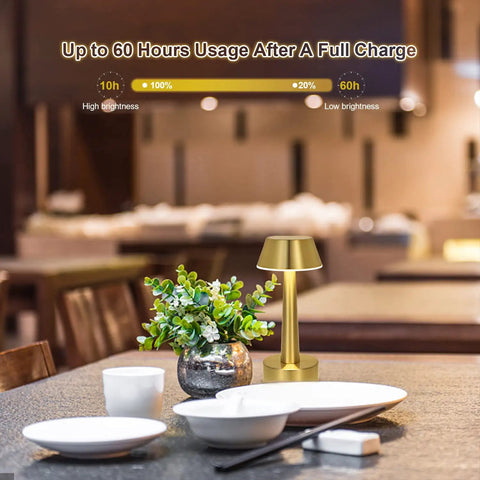 Cordless Gold Battery Operated Table Lamp For Dining Ambience on restaurant table with dishes and plant