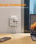 Frictionless Multi Plug Outlet Extender With Four AC Power Jacks And Three Fast USB Charging Ports Smooth Design Wall Tap For Desk Home Office Setup mounted on wall with charger and laptop.