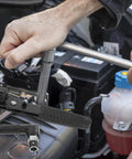 Compact Mini Ratcheting Wrench And Socket Tool Kit Tough As Nails Steel Spanners And Tight Squeeze Repairs For Automotive And Household Projects in use on an engine.