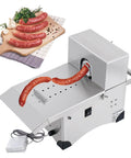 Top Shelf Commercial Electric Sausage Tying Machine Featuring Solid Stainless Steel Build And No Sweat Foot Pedal For Effortless Auto Knotting With Precisely Adjustable Link Sizes with sausages in view.