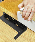 Installation of Beefy Heavy Duty Floating Shelf Brackets Two Pack Thickened L Shaped Steel Support on wood surface
