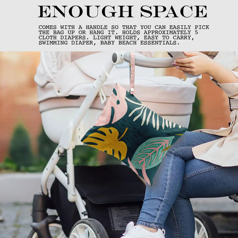 Waterproof Wet Bag For Travel And Beach Days, 26x32cm design with palm leaf tropical print, hanging on stroller handle.