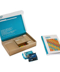 Top Shelf Electronics Learning Kit For Absolute Beginners With Straight Up Step By Step Guides Featuring Compatible Sensor Modules And Robot Tools To Fast Track Your Maker Projects, showing open starter kit with Arduino board and guide.