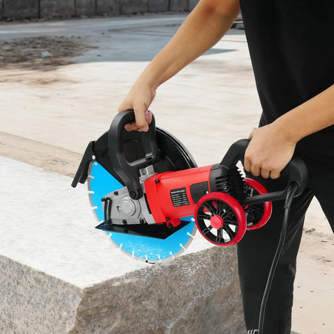 Heavy Duty Electric Concrete Cutter With 13 Inch Diamond Blade And Rolling Stand 4000W, held for basement wall cutting.