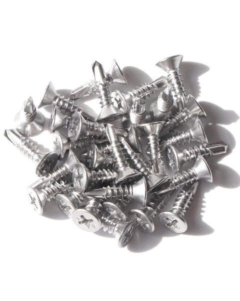 Pile of Self Drilling Tek Screws Number Ten By Three Quarters Inch 410 Stainless Steel Flat Head Phillips Sheet Metal Fasteners