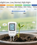 No Fuss All In One 5 In 1 Soil Tester With Dual Probe Digital 2026 Soil Meter placed in potted soil near green sprout