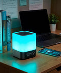 Five In One Night Light Bluetooth Speaker Alarm Clock MP3 Player With Touch Sensor LED Lamp on desk near laptop