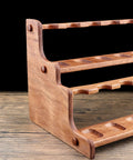 Premium Solid Wood Pipe Stand Featuring 16 Custom Cubbies Double Tier Desktop Tobacco Display Rack side view on wooden table