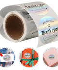 Roll of Thank You Stickers For Packaging And Gift Wrapping with copper plate adhesive, shown on various gift items