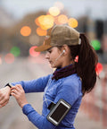 Woman running in blue outfit wearing Brown Trucker Hat With Ventilated Top Holes, Breathable All Season Cap For Running, Hiking