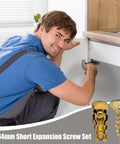 Man using Expansion Screw Set For Drywall And Concrete Pro Grade Carbon Steel Wall Anchors on cabinet hinge