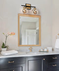 Modern Vanity Light Over Mirror With Mercury Glass Shades In Black And Gold Finish for Bathroom over a marble countertop