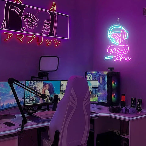 Gaming setup with pink chair, multiple monitors, and neon signs, including 'Game Zone' with headphones and glowing design