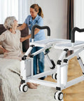Real Smooth Electric Toilet Raiser Chair With Locked Grip Handles, Solid Build Mobile Commode For Seniors, Motorized Tilt Action, Universal Bath Fit Holds 220 Lbs Total No Sweat Setup in use by caregiver and senior.