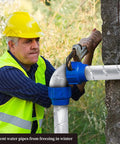 Worker installing Outdoor Pipe Insulation Wrap Two Inch By Thirty Two Point Eight Feet With Foam And Foil Self Adhesive Tape
