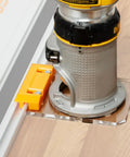 Real Deal Router Guide Rail Adapter For DeWalt DWP611 And DCW600B Fixed Base Trim Routers on guide rail, showing precision fit.