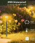 4 Pack Dusk To Dawn Outdoor Pathway Lights illuminating garden with IP65 waterproof, rain, heat, and frost resistance features.