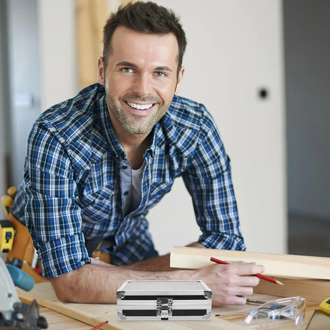 Rugged As Nails Portable Aluminum Tool Box With Secure Locking Lid And Impact Resistant Carry Case on wood table with smiling man.
