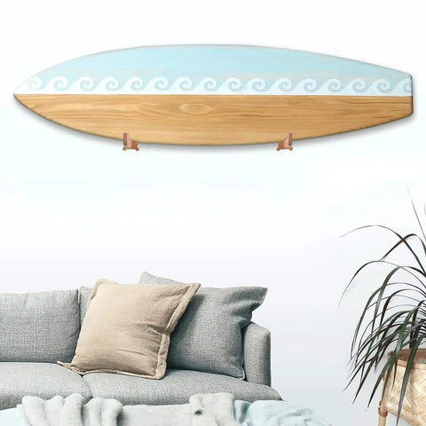 Premium Spliced Beech Wood Surfboard Wall Mount Rack Vertical Storage Shelf For Shortboards Longboards And Skimboards displayed above a couch.