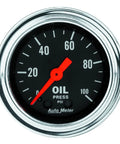 Front view of chrome Auto Meter oil pressure gauge, 2-1/16 in., mechanical, black dial with red needle