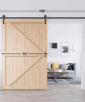 Solid Spruce Wood Sliding Barn Door 54X84 with 9 Ft K Frame Hardware Kit displayed in a modern living room.