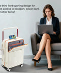Woman using laptop next to 20 Inch Carry On Luggage With Dope Spinner Wheels And USB Port, front compartment open, white hard shell.
