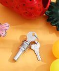 Thinking Process: silver metal flat lock and two keys for gumball candy machine, close-up