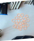 Must Have Go To 20 Piece Flat Copper Washer Kit For Automotive And Plumbing, High Precision Sealing Gaskets For Oil Drain Plug And Hydraulic Fittings, Copper Washers For Leak Free Performance And Quick Heat Dissipation. 20 flat copper washers on a light surface
