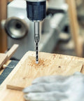 Badass 4 Piece Steel Mortising Chisels Set Knocking Out Crisp Square Hole Cuts For Precision Woodworking Joints, drilling into wood with hollow bit.