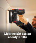 Heavy Duty Cordless Brad Nailer Fueled By 20V Brushless Motor And 18 Gauge Specs held at wall with light grip.