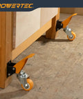 Heavy Duty Workbench Caster Kit With Retractable Stepdown Swivel Wheels Set Of Four Two Point Five Inch TPR Casters 600 Pound Rock Solid Shop Furniture Gear For Hassle Free Rolling close-up of orange foot pedal and swivel wheel