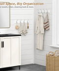White Wall Mount Coat Rack 4 Pack With 16 Hooks The Go To Key Holder And Bag Hanger For Closet Hats Belts Purses Backpacks Leashes Space Saving Wall Organizer For Home And Hallway mounted on bathroom wall holding towels and robes.