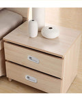Nightstand with stainless steel oval recessed sliding door flush pull handle installed, 120mm by 40mm brushed satin nickel finish