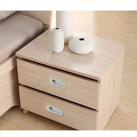 Nightstand with stainless steel oval recessed sliding door flush pull handle installed, 120mm by 40mm brushed satin nickel finish
