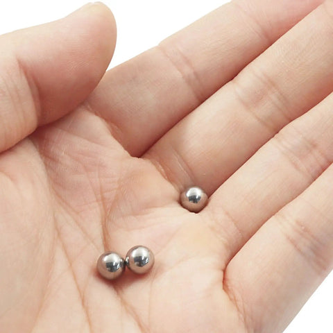 Carbon Steel Bearing Balls 6mm Set Of 100, Precision Ground And Smooth Finish For Machinery, Durable Bearing Components That Reduce Maintenance And Deliver Reliable Performance, shown in hand