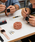 Two men repairing watches with a Top Grade Solder Tip Cleaning Brush Made With Heavy Duty Wire Sponge For High Temp Irons.
