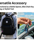 Person holding Six Pack Bicycle Bottle Opener Keychain Kit With Chain Key Ring Tools for Cyclists and Bikers near a car.