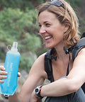 Collapsible Soft Flask Water Bottle With Ergonomic Easy Squeeze held by smiling hiker, outdoor adventure ready