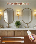 Two Pack Crystal Rechargeable Wireless Wall Sconces Featuring Brushed Gold Finish With Adjustable Dimming Remote And Multi Hue Settings built in a stylish bathroom.